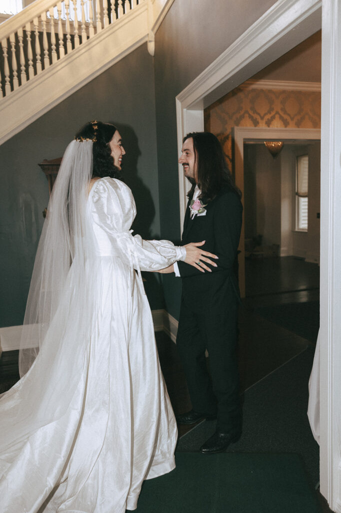 bride and groom first look at their coquette themed wedding 