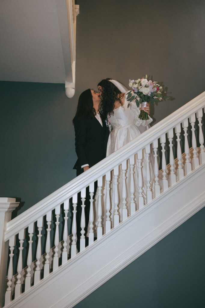 cute picture of the bride and groom kissing 