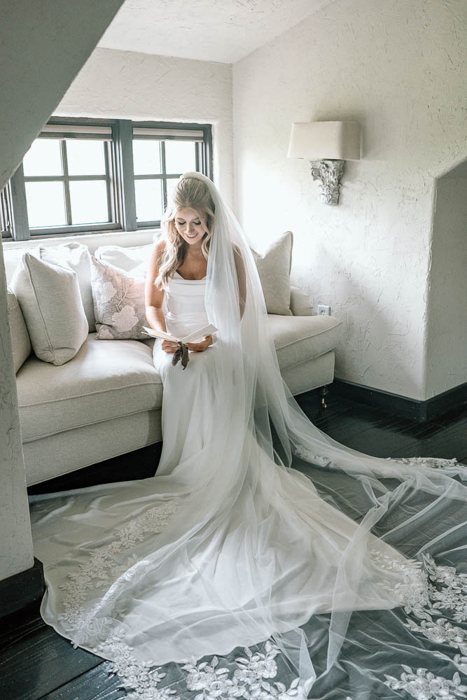 bride reading a letter the groom sent her before the ceremony 