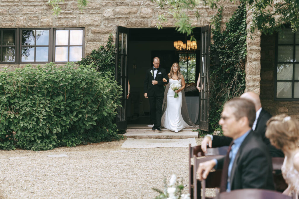 stunning picture of the bride walking down the aisle 