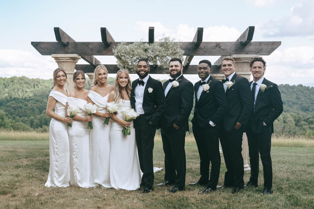 picture of the bride and groom with their wedding party