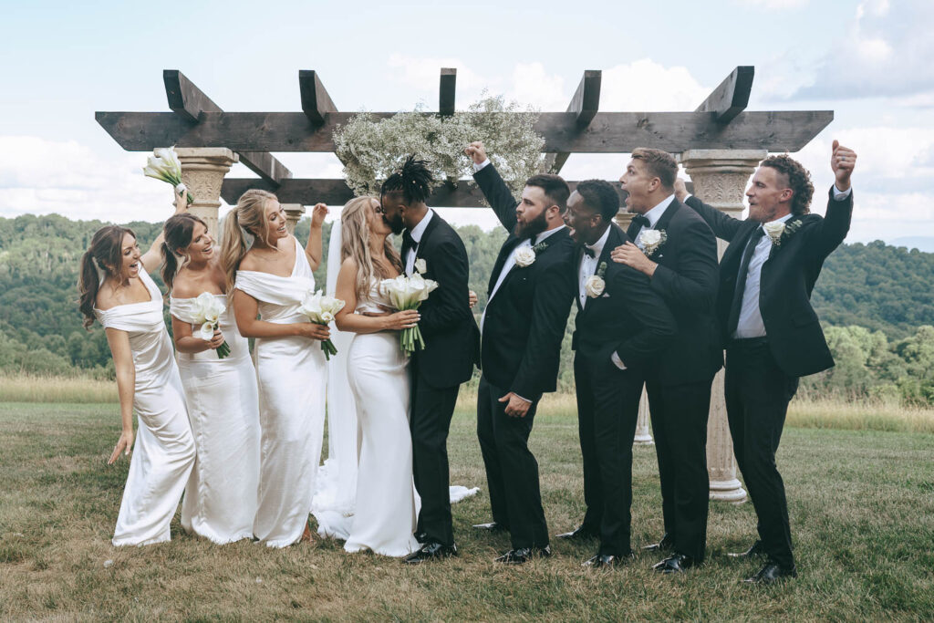 picture of the bride and groom with their bridesmaids and groomsmen 