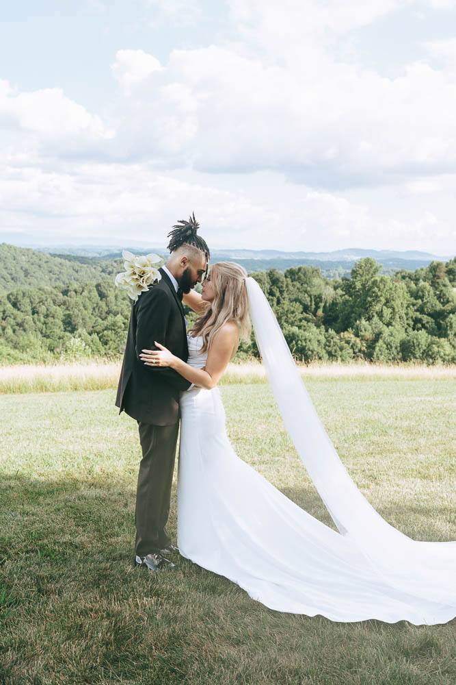 portrait of the bride and groom looking at each other 