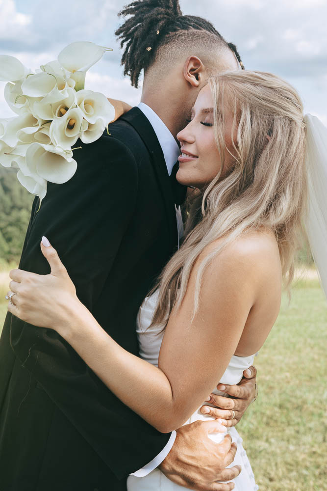 picture of the bride and groom hugging