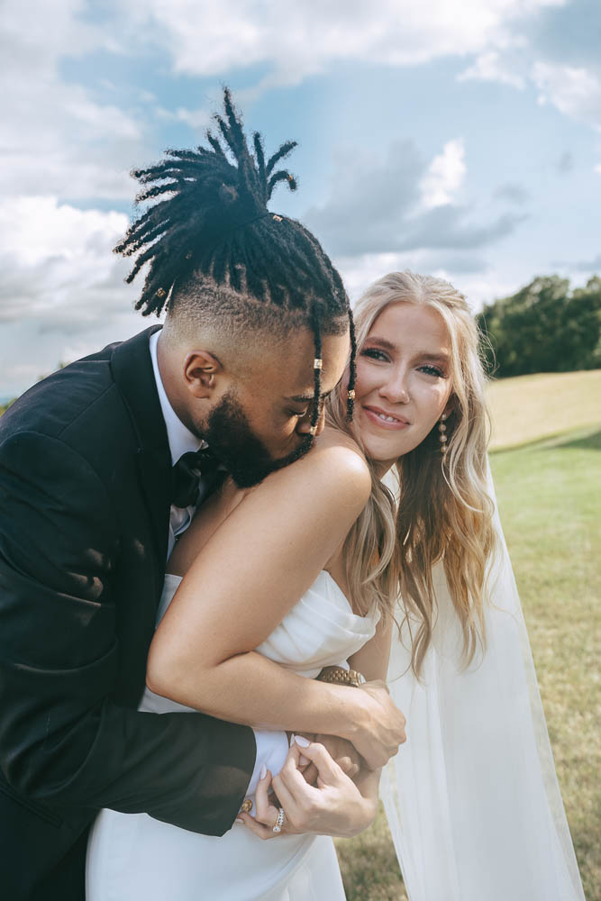 cute and playful picture of the bride and groom