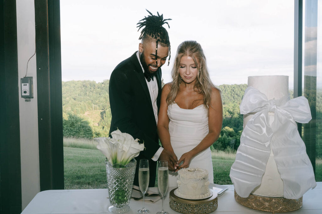 newlyweds cutting their wedding cake