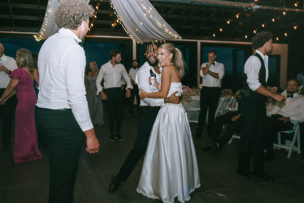 cute couple dancing with their wedding guests 