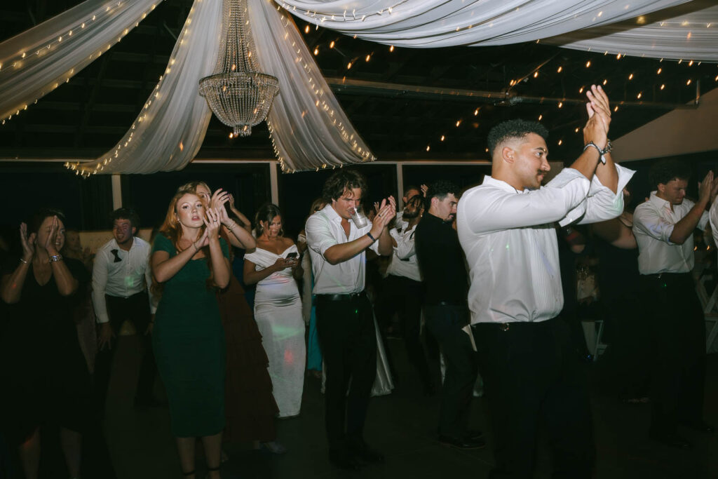 wedding guests dancing at the reception party