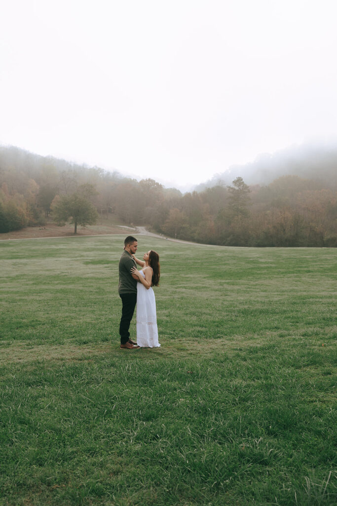 cute couple looking at each other during their photoshoot