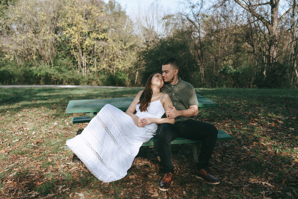 fiance kissing his fiancé on the cheek