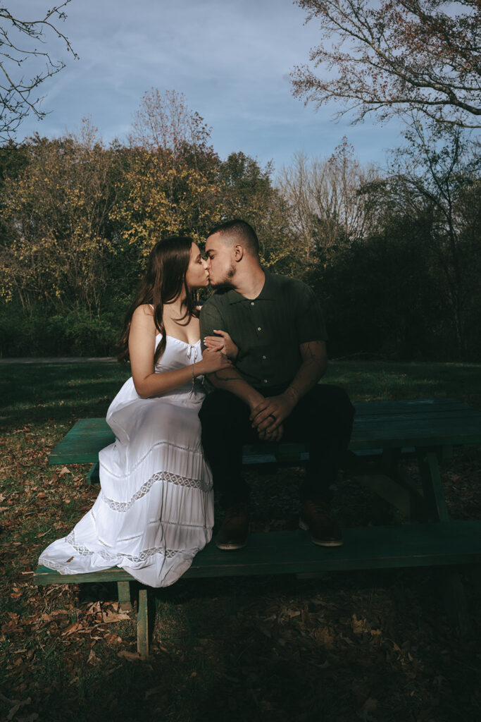 couple kissing at their winter engagement session