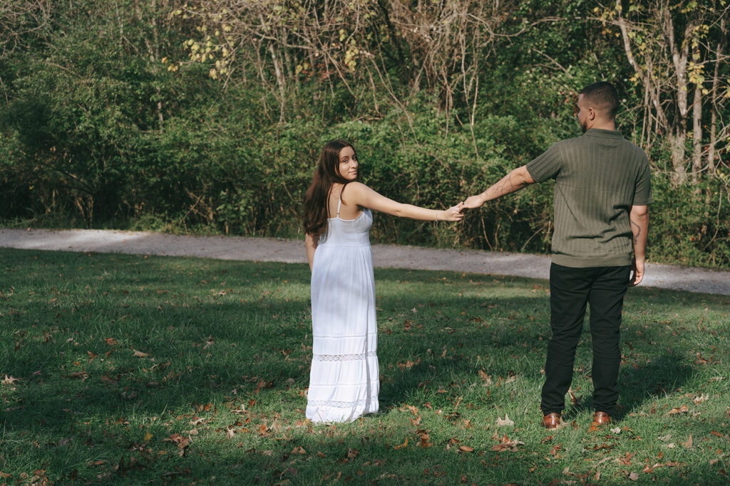 cute engagement photoshoot in a field