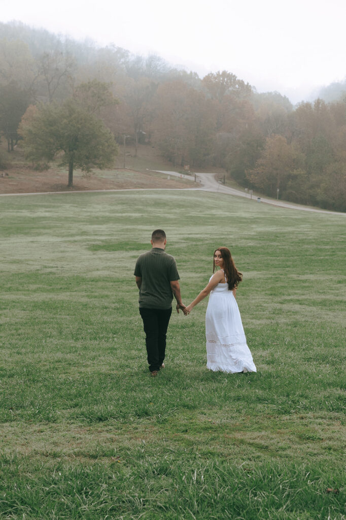 happy couple at their foggy winter engagement session