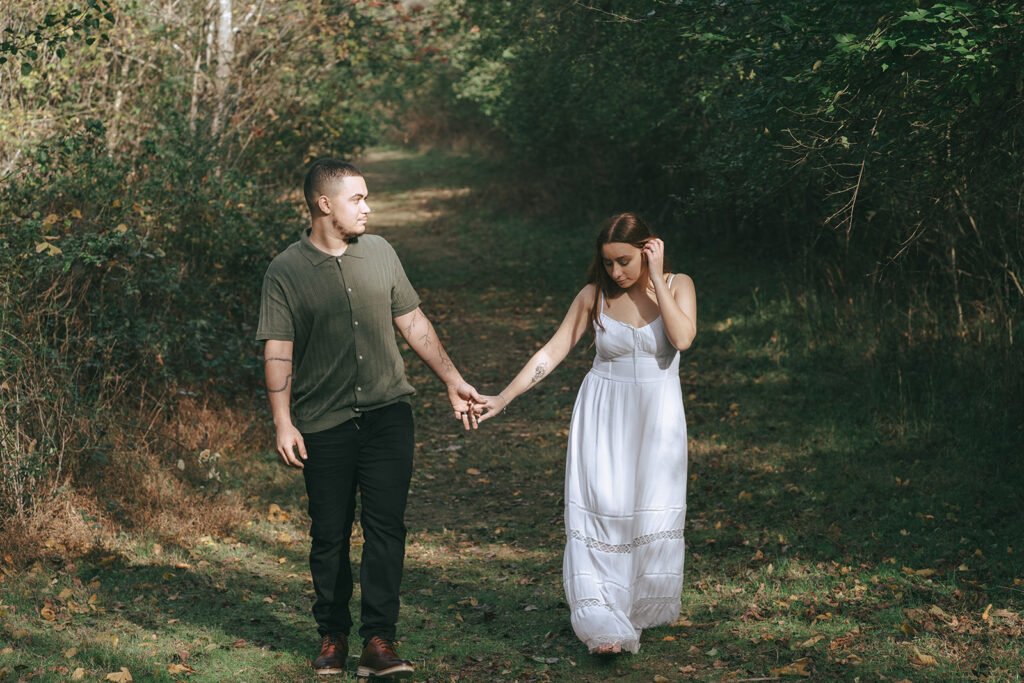 cute couple walking around their engagement location