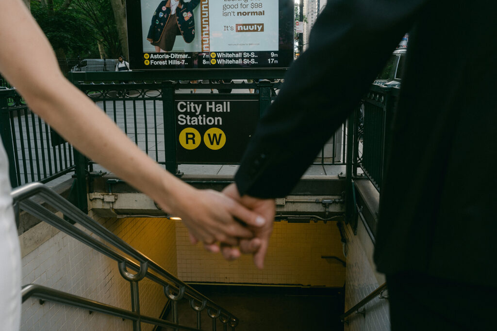 cute couple holding hands walking around NYC 