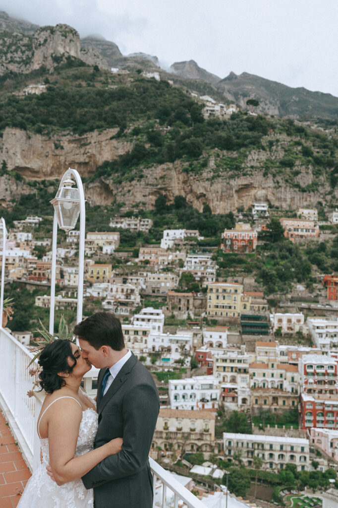 bride and groom kissing at their amalfi coast wedding