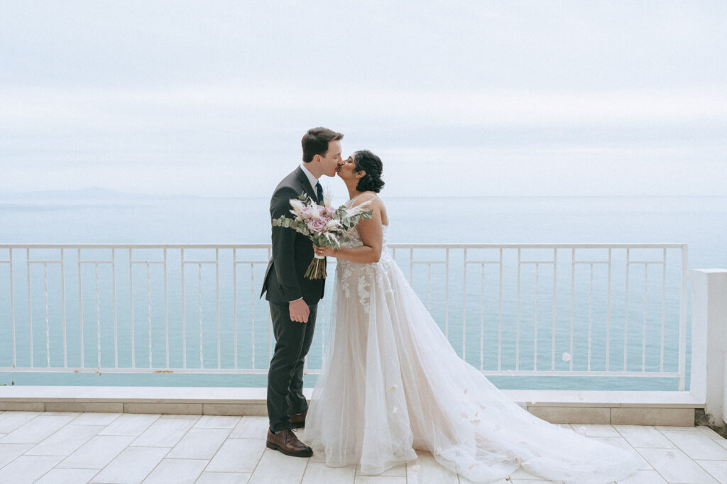 bride and groom kissing during their bridal portraits