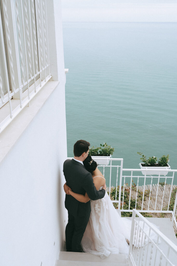 cute picture of the bride and groom hugging 