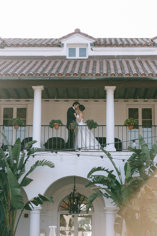 cute picture of the bride and groom kissing after their ceremony