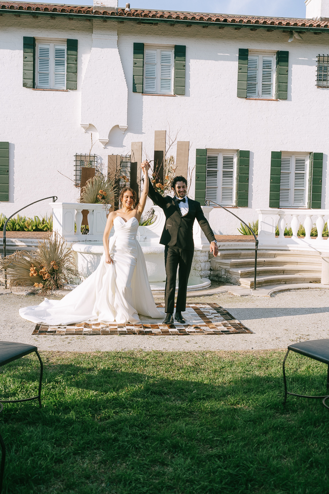 cute picture of the newlyweds heading to their reception