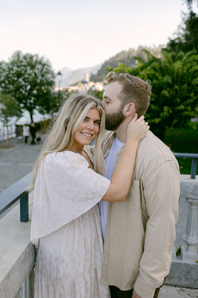 fiance kissing his fiance on the cheek
