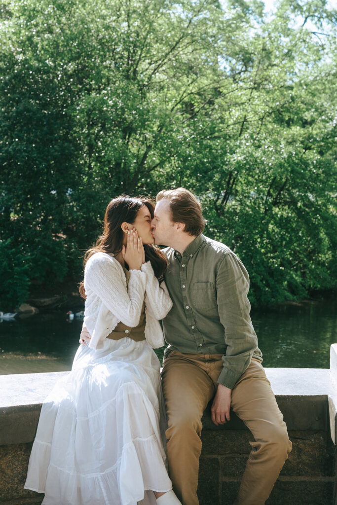 cute couple kissing during their engagement photoshoot