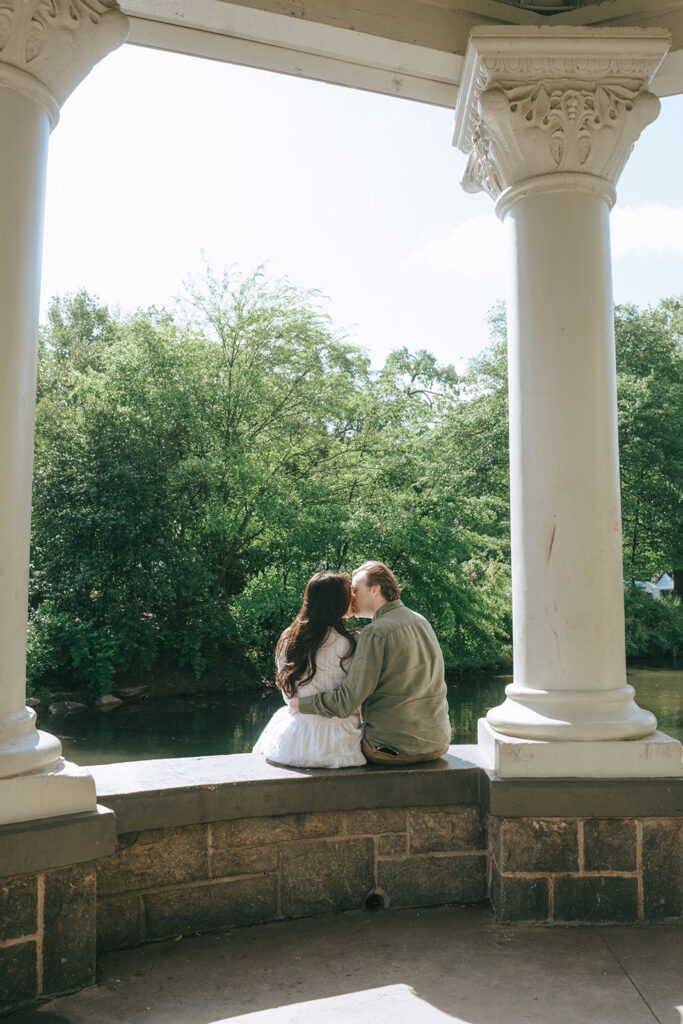 picture of the fiances kissing during their photoshoot