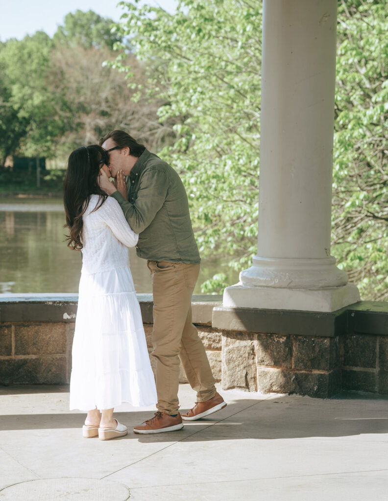 couple kissing after their engagement 