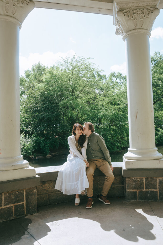 fiance kissing his fiance on the cheek
