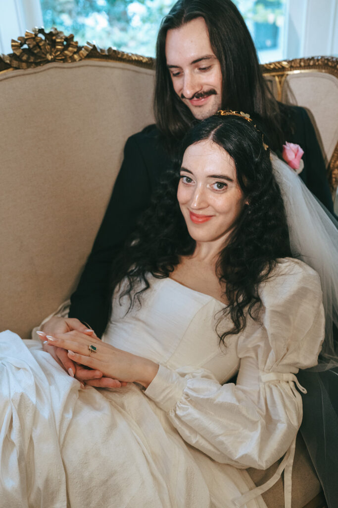 cute couple smiling at the camera during their photoshoot