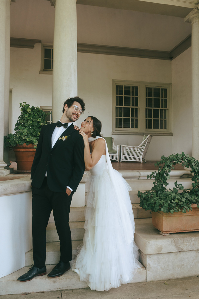 cute picture of the bride smiling at the groom