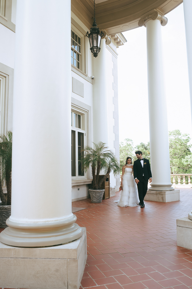 cute couple walking around their wedding venue
