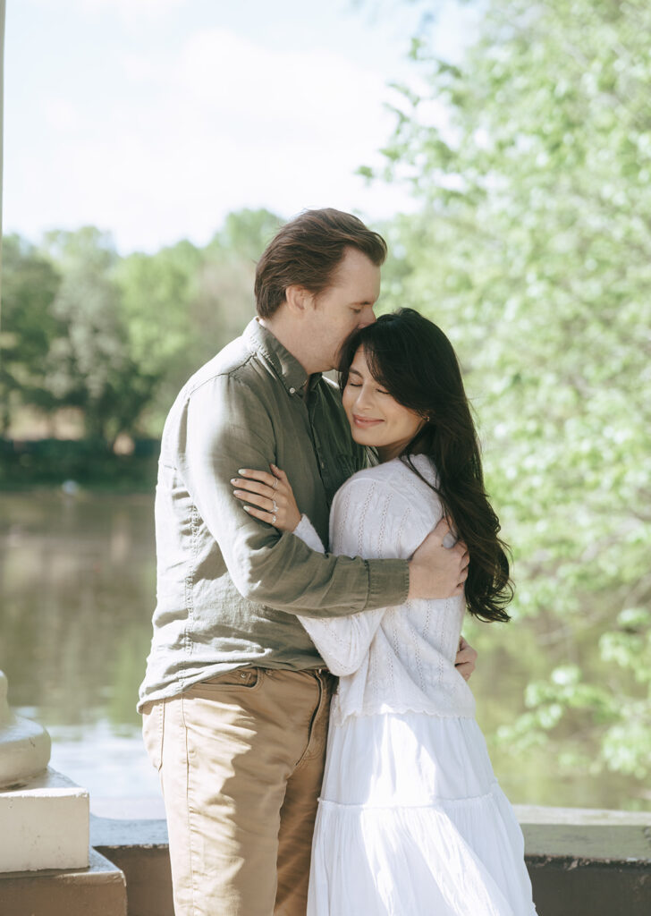 fiance kissing his fiance on the forehead