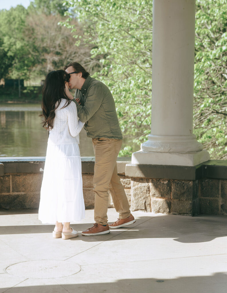 cute couple kissing after their proposal
