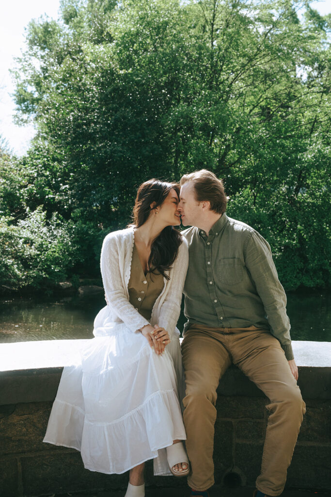 picture of the newly engaged couple kissing