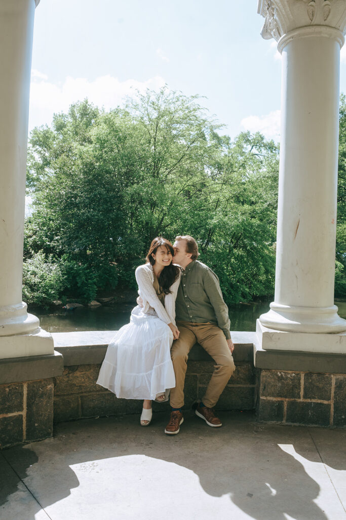 fiance kissing his fiance on the cheek