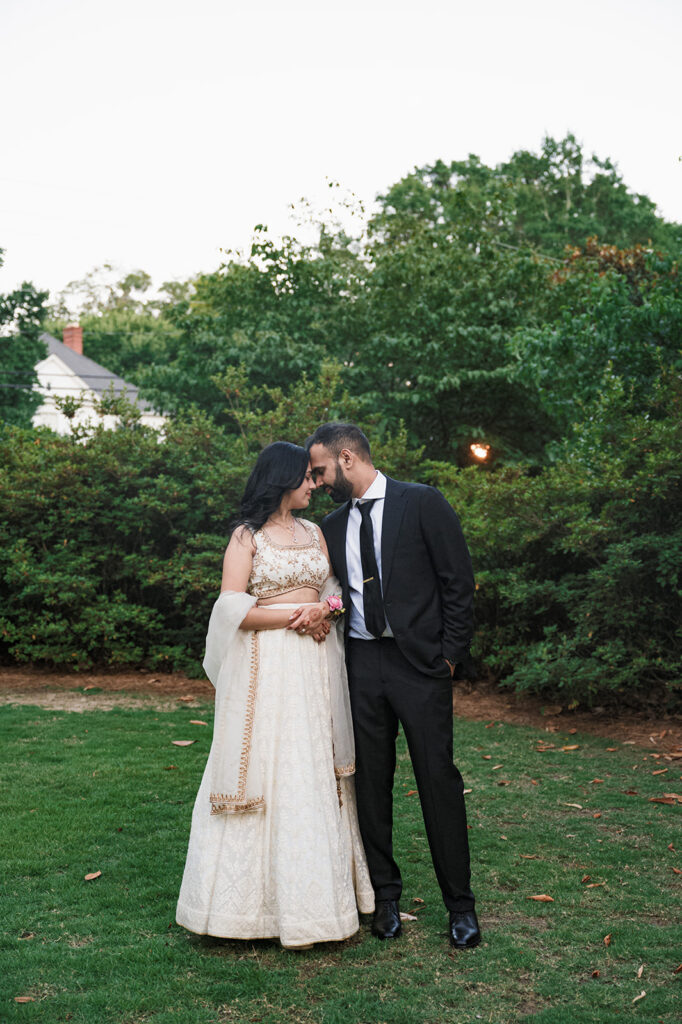 groom kissing the bride on the cheek during their golden hour bridal portraits