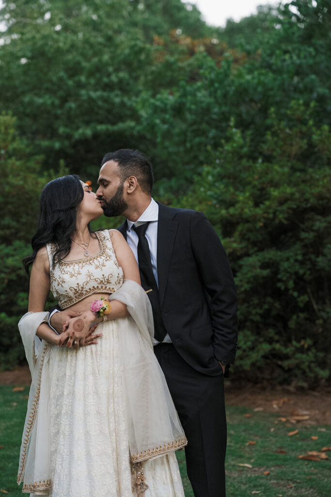 cute picture of the newlyweds kissing