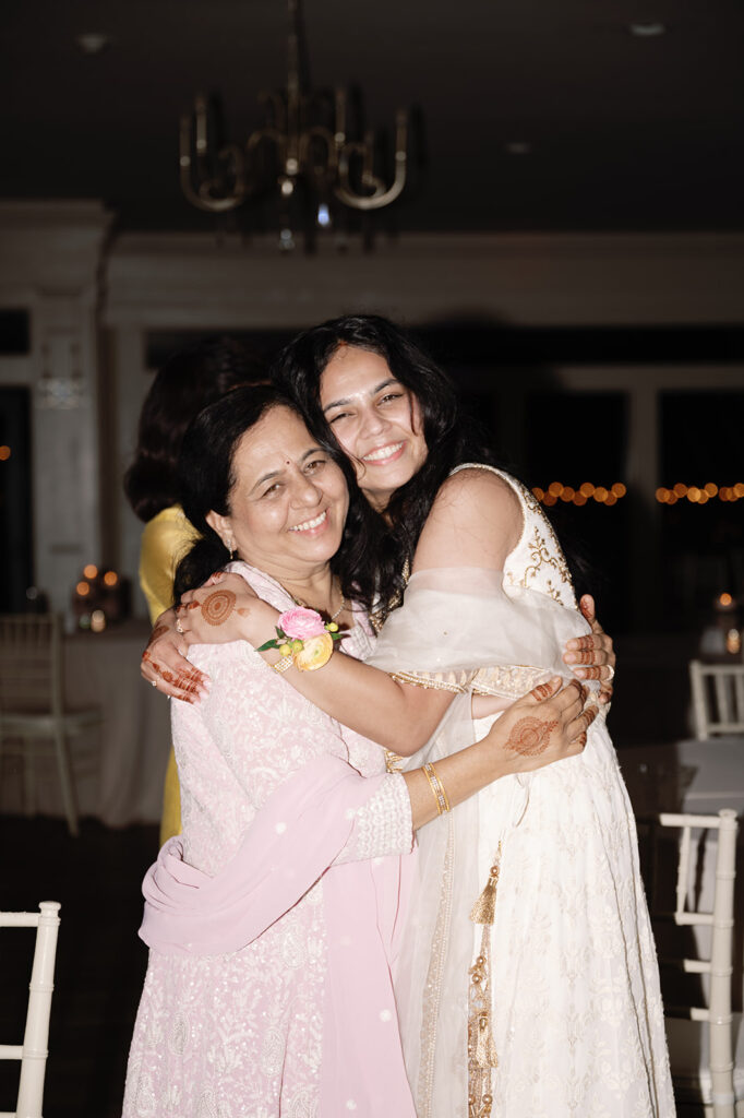 cute picture of the bride and her mom hugging