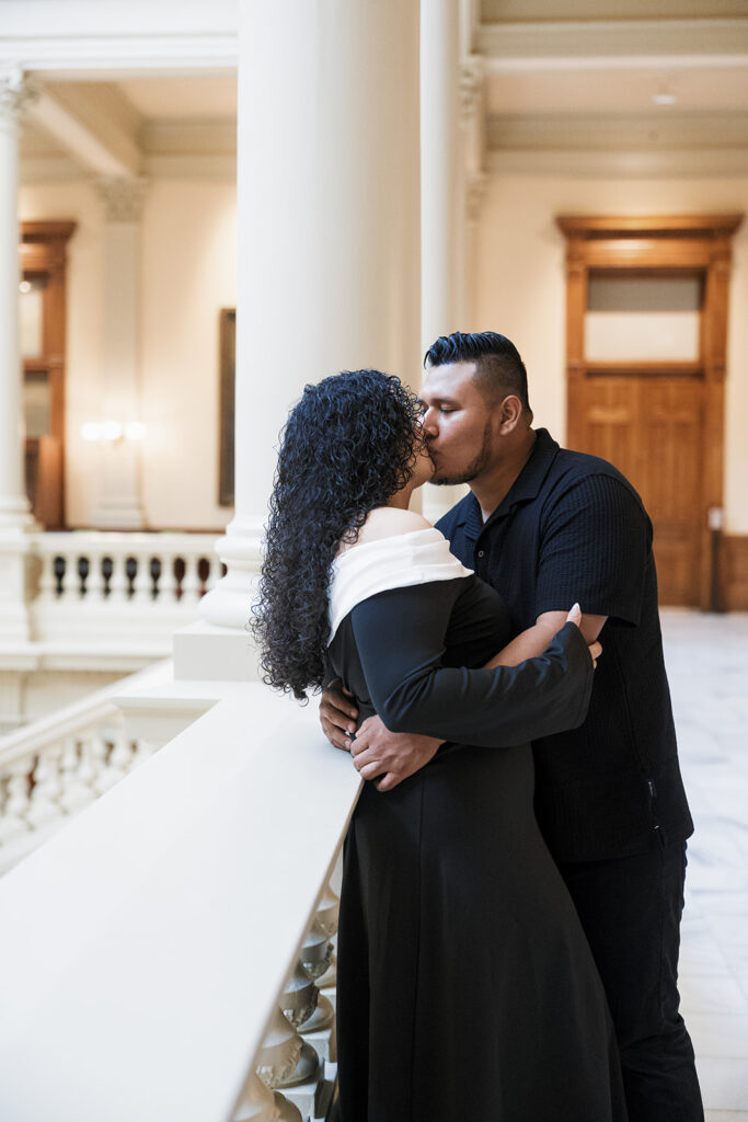 picture of the newly engaged couple kissing during their photohsoot