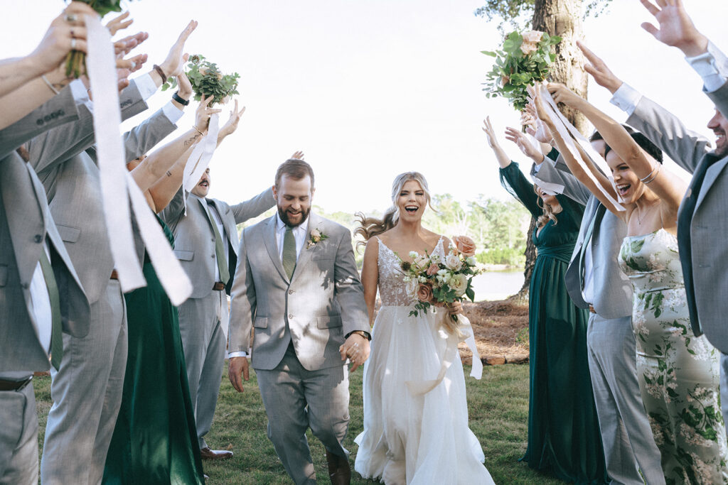 Happy couple at their bridal photos with their bridal party