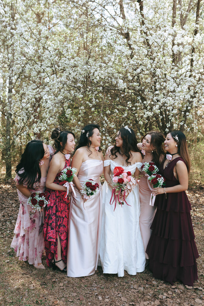 Cute picture of the bride and her bridesmaids laughing with each other