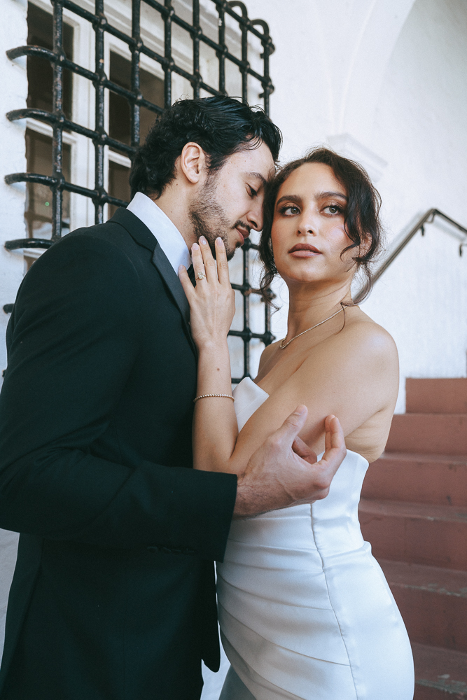 groom kissing the bride on the cheek
