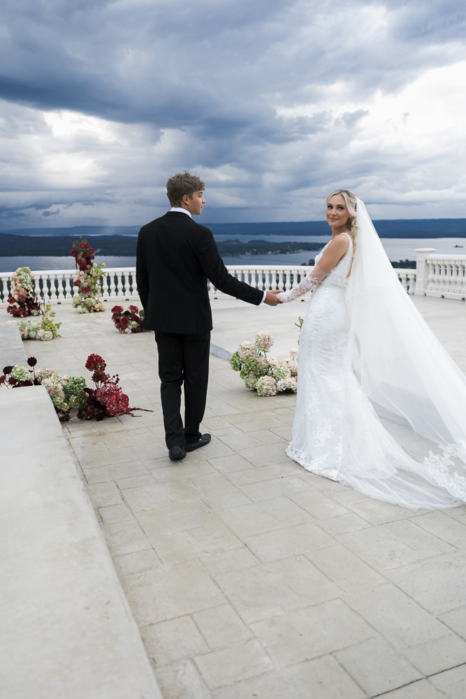 bride and groom walking around their dream wedding venue