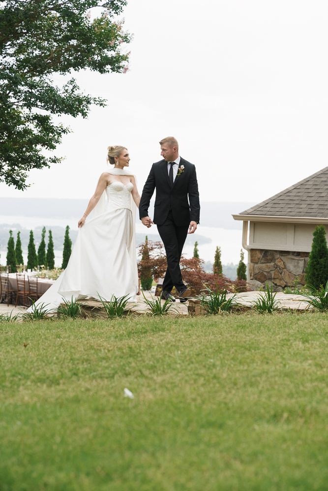cute couple holding hands during their bridal photos 
