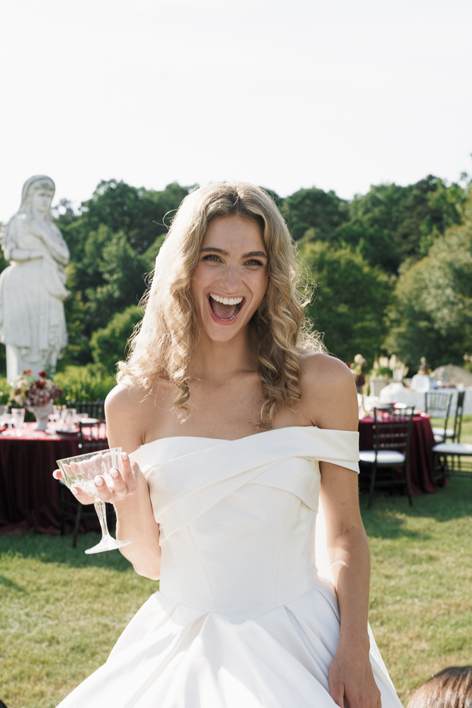 Cute picture of the bride celebrating with champagne