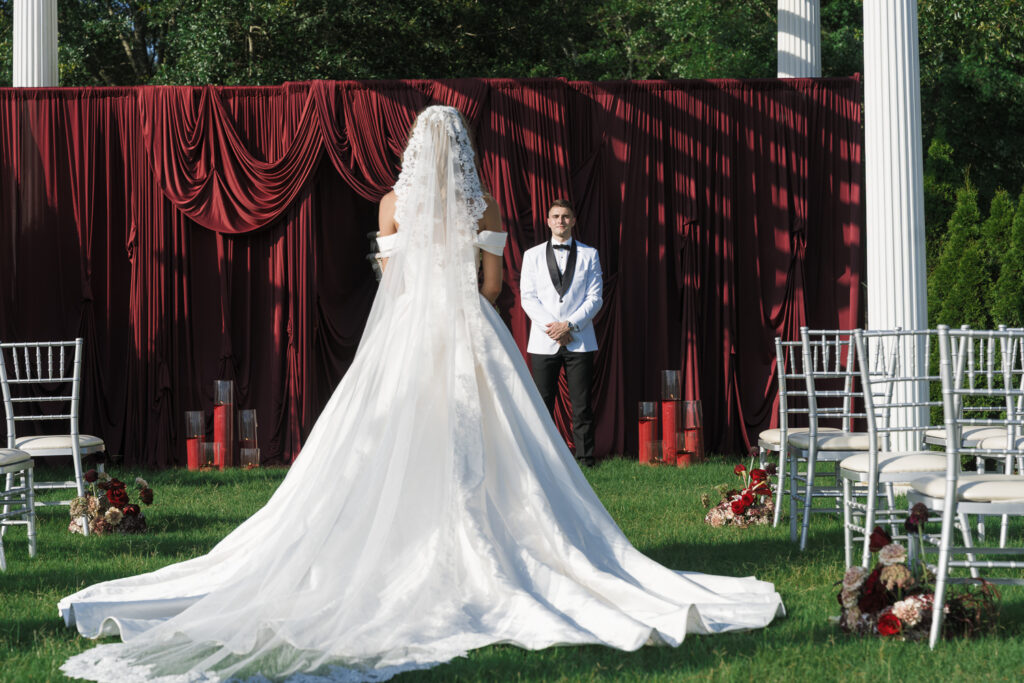 Groom, watching the bride walk down the aisle