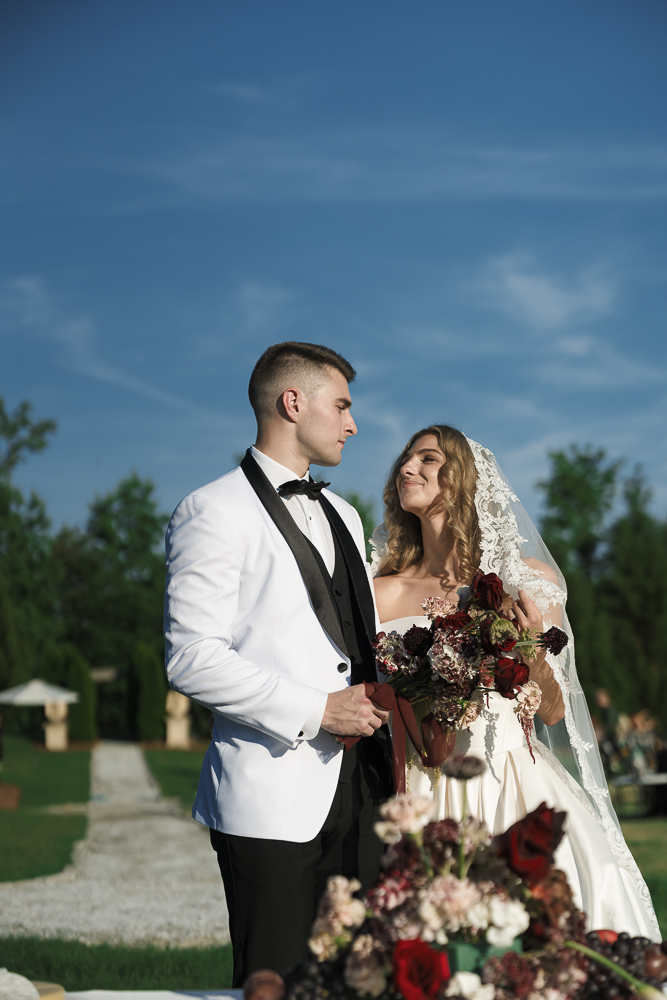 Stunning picture of the newly married couple smiling at each other