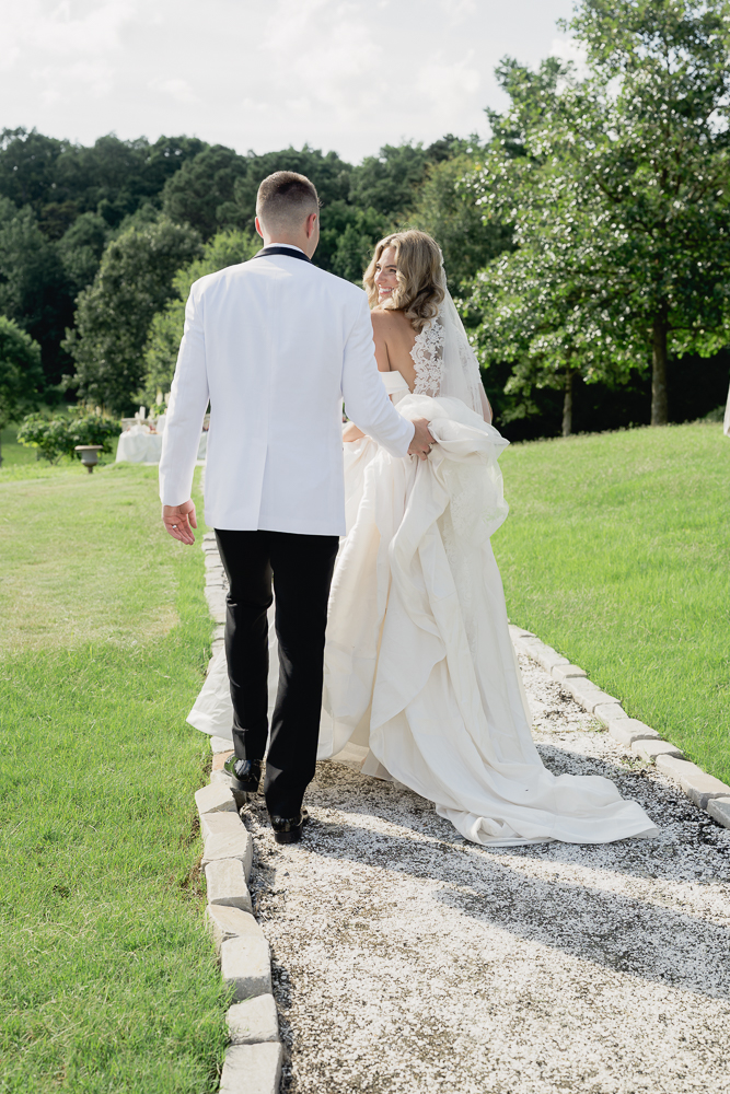 cute portrait of the bride and groom walking around their wedding venue