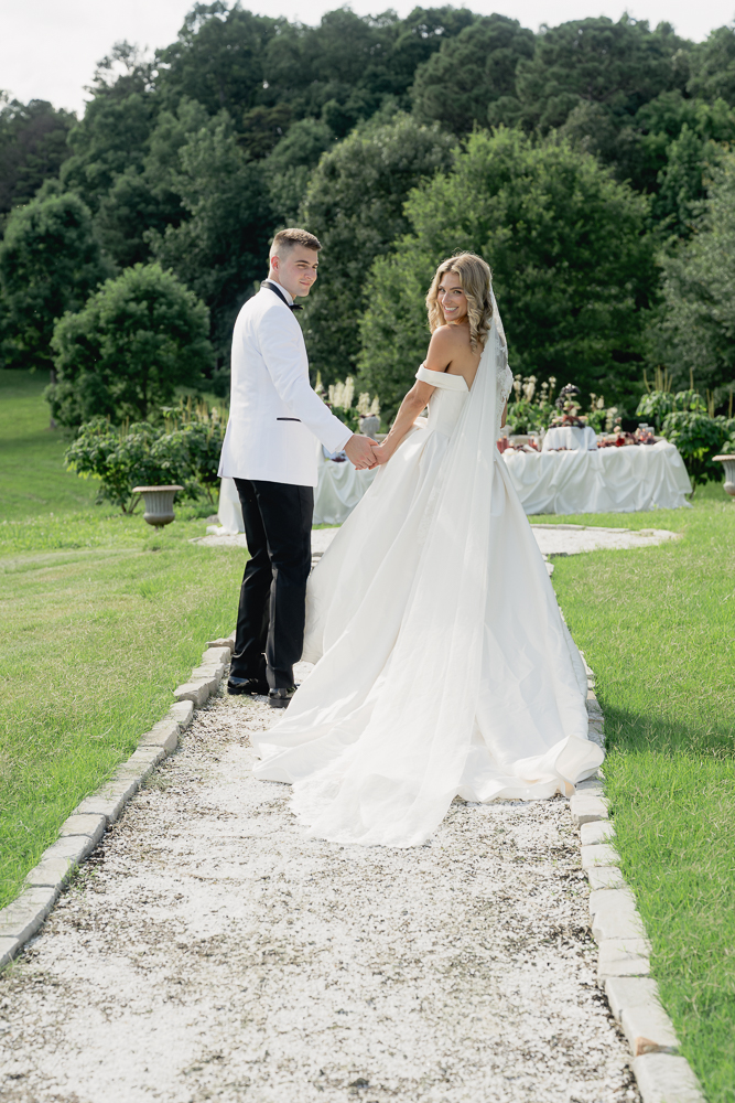 picture of the bride and groom holding hands